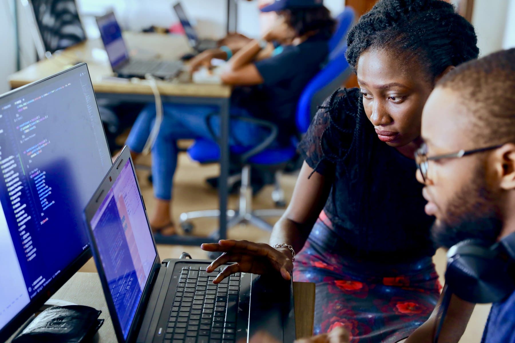 Two engineers reviewing code together